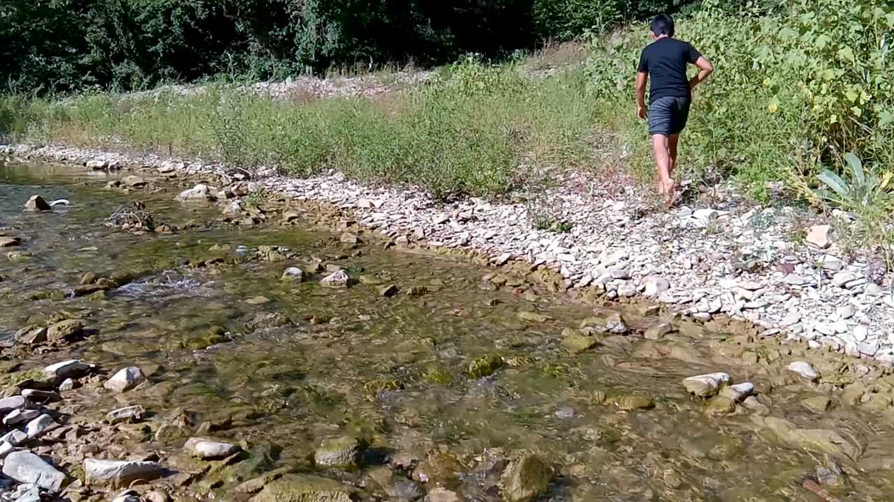 Child walking through a shallow stream