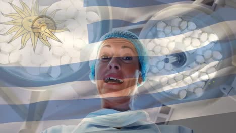 animación de la bandera de uruguay ondeando sobre el cirujano en el quirófano
