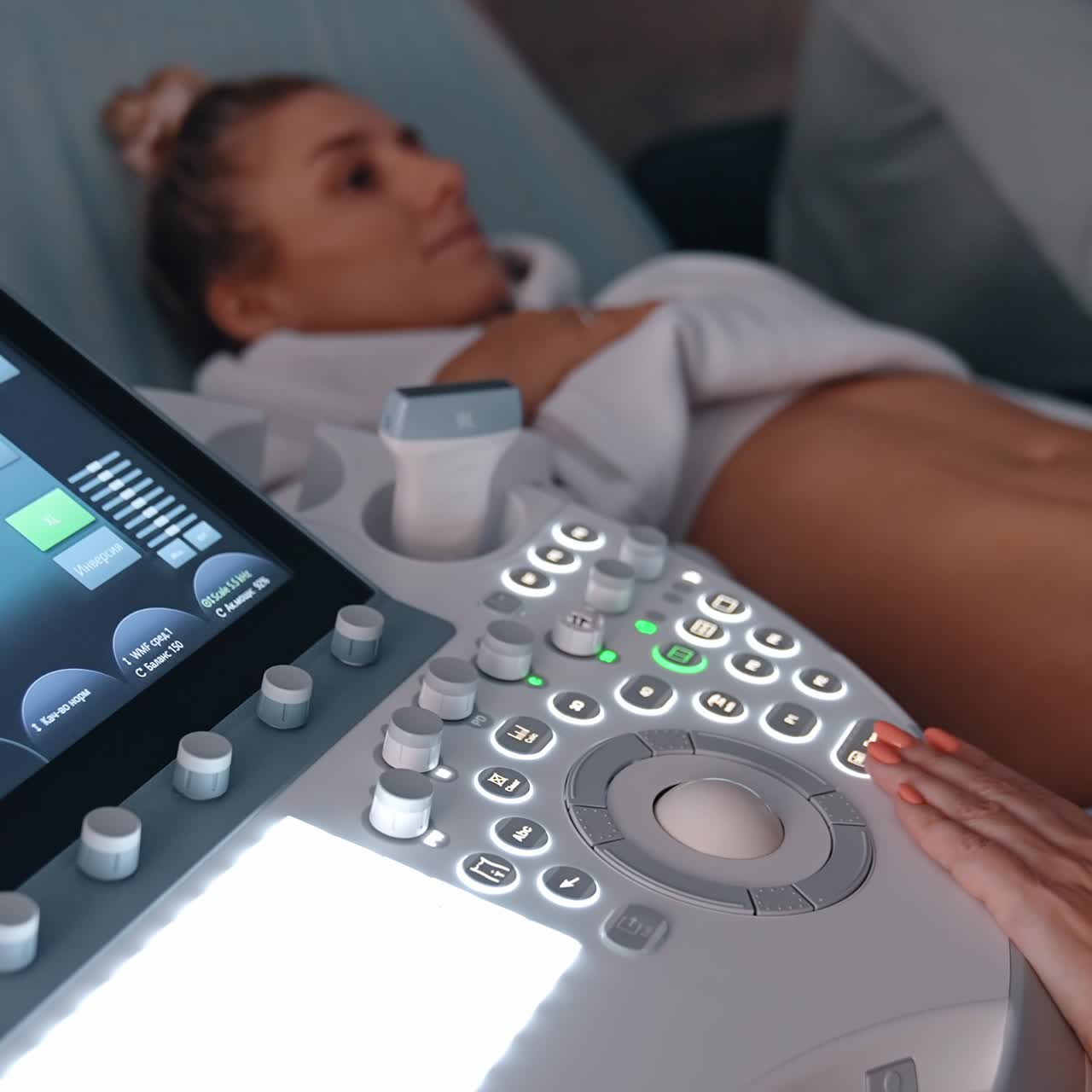 Obstetrician performs ultrasonic examination for the pregnant lady. Future parents having ultrasound examination