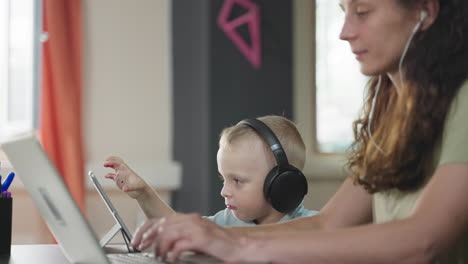 mother and child learning together at home