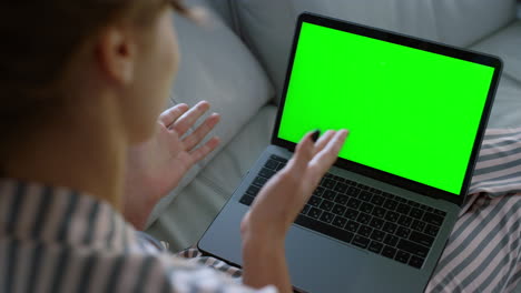 freelancer chatting green screen computer on sofa closeup. girl talk online home