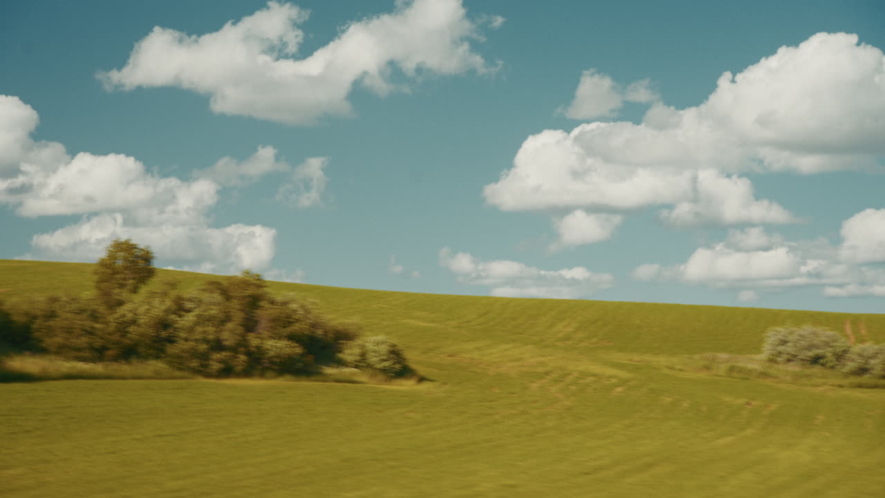 Rolling Hills and Cloudy Sky