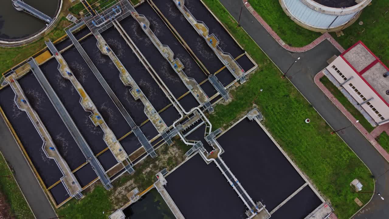 Water treatment facility showing tanks and processing areas from above