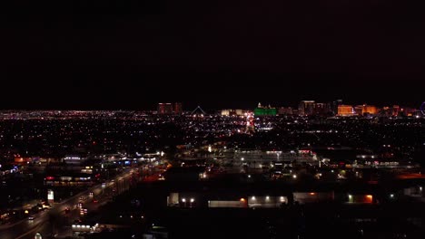 super wide aerial descending dolly shot of the south side of the las vegas strip at night