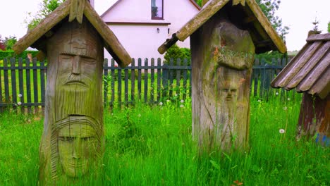 handcrafted arts showcase on grassy backyard at the house museum of chata-kaszubska in northern poland