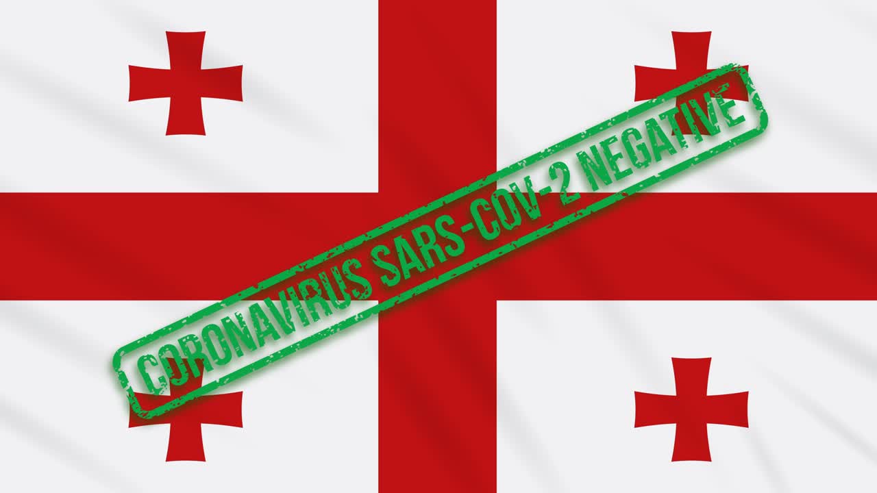 조지아는 코로나바이러스로부터의 자유의 녹색 스프를 가진 발을 흔들고 있습니다.