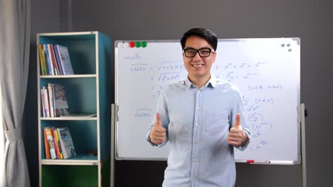 asian teacher with a thumbs up