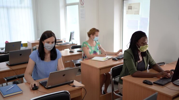 Multietnic group of coworkers sitting in board room