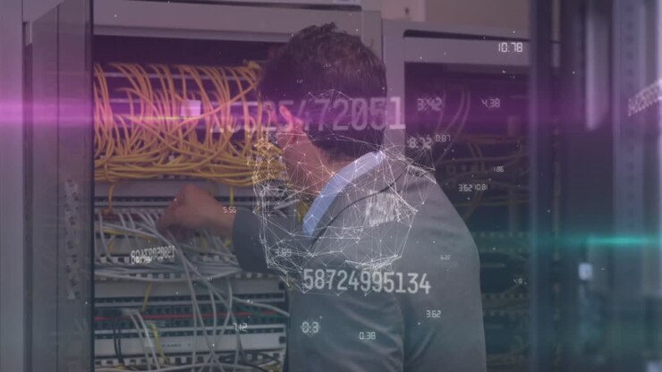 Globe of network of connections against caucasian male engineer working in computer server room