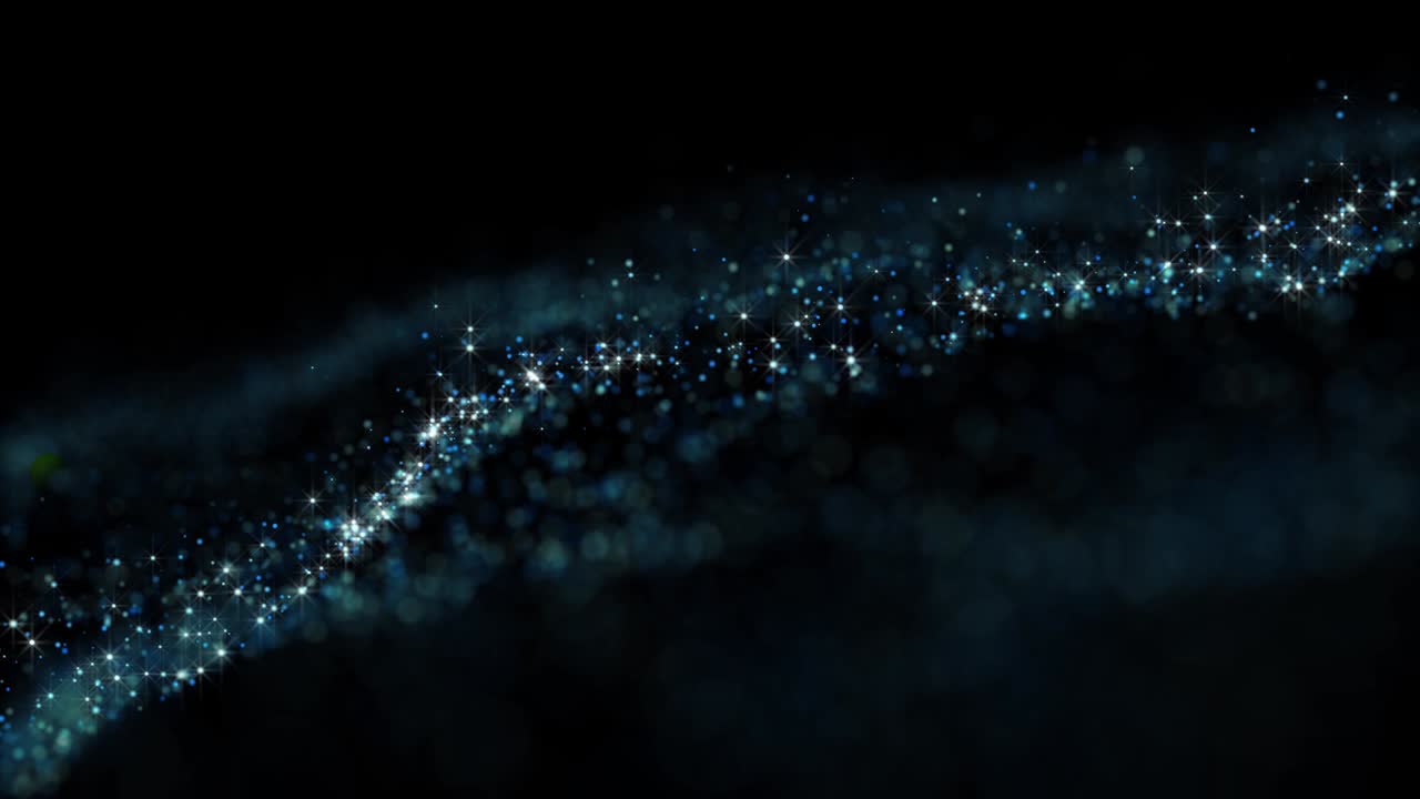 Animated background with particles with a shallow depth of focus.