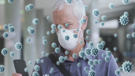 Animation-of-covid-19-cells-over-senior-man-wearing-face-mask