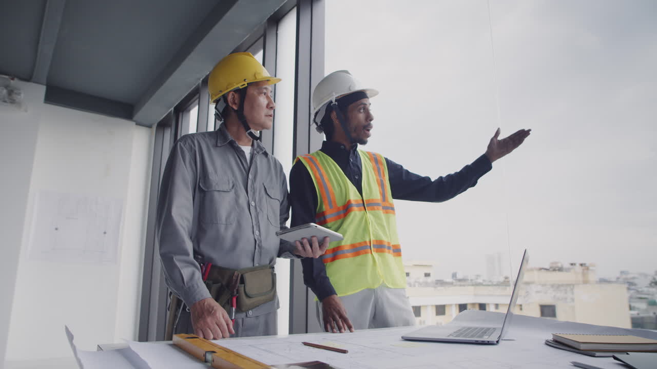 Foreman Giving Instructions to Construction Worker