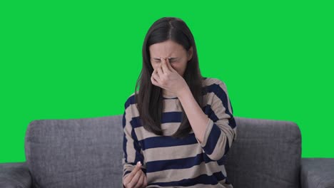 indian girl taking medicine in headache green screen