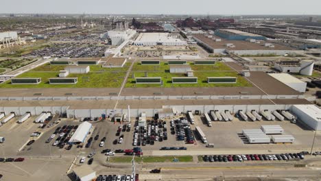 high angle sliding shot of ford rouge electric vehicle center with green roof, assemble the new f150 lightening