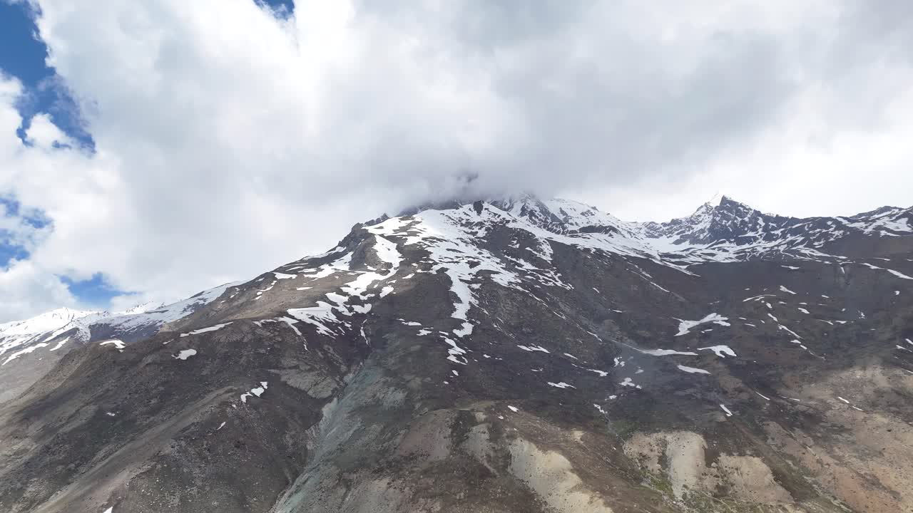 Aerial drone shot revealing the untouched wilderness of Ladakh’s remote high-altitude mountains.