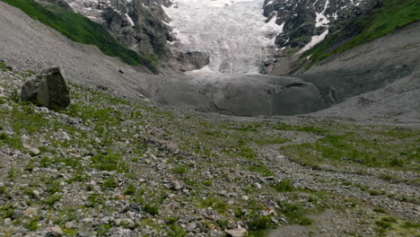 Flying-Over-Rocky-Mountain-To-Adishi-Glacier-Tongue-At-Daytime-In-Svaneti,-Georgia