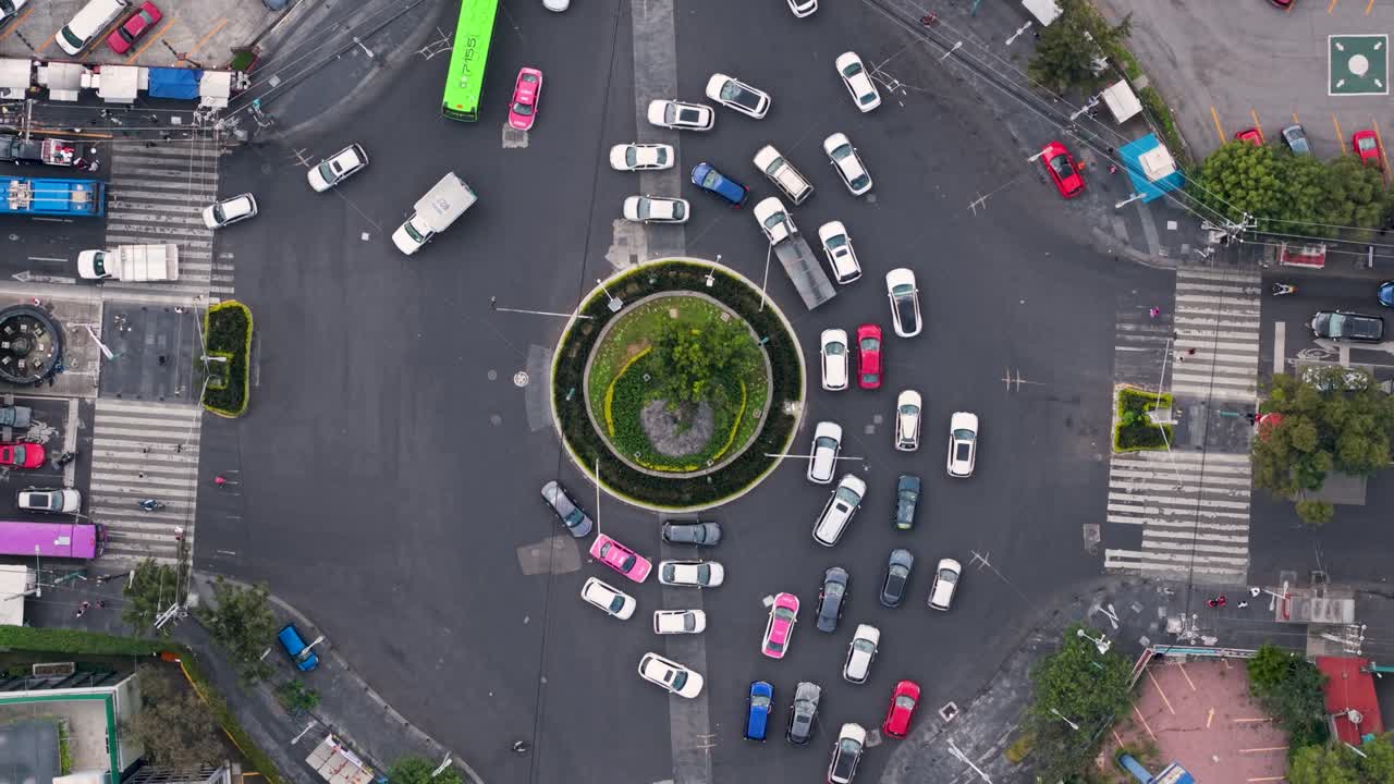 Drone footage from elevation showing congested roundabout in CDMX