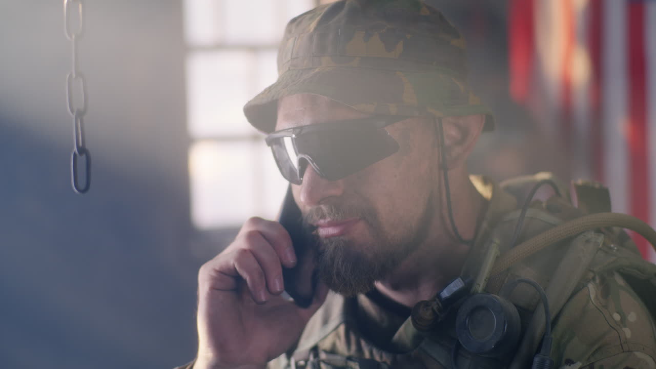 Soldier Talking on Phone in Military Gear