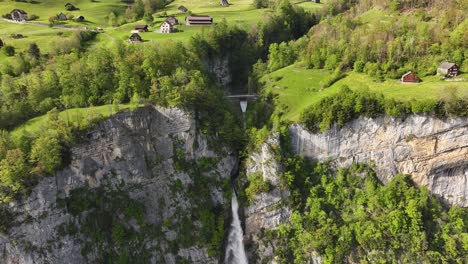 aerial view of seerenbach falls' majestic cascade in switzerland - amden betlis walensee