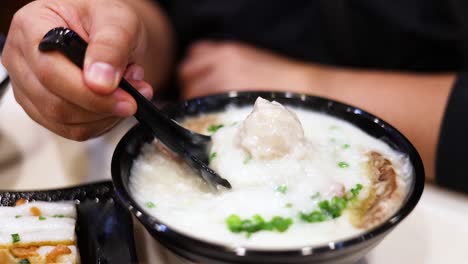 savoring a bowl of rice porridge