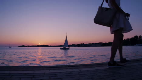 Couple Walking on Pier at Sunset