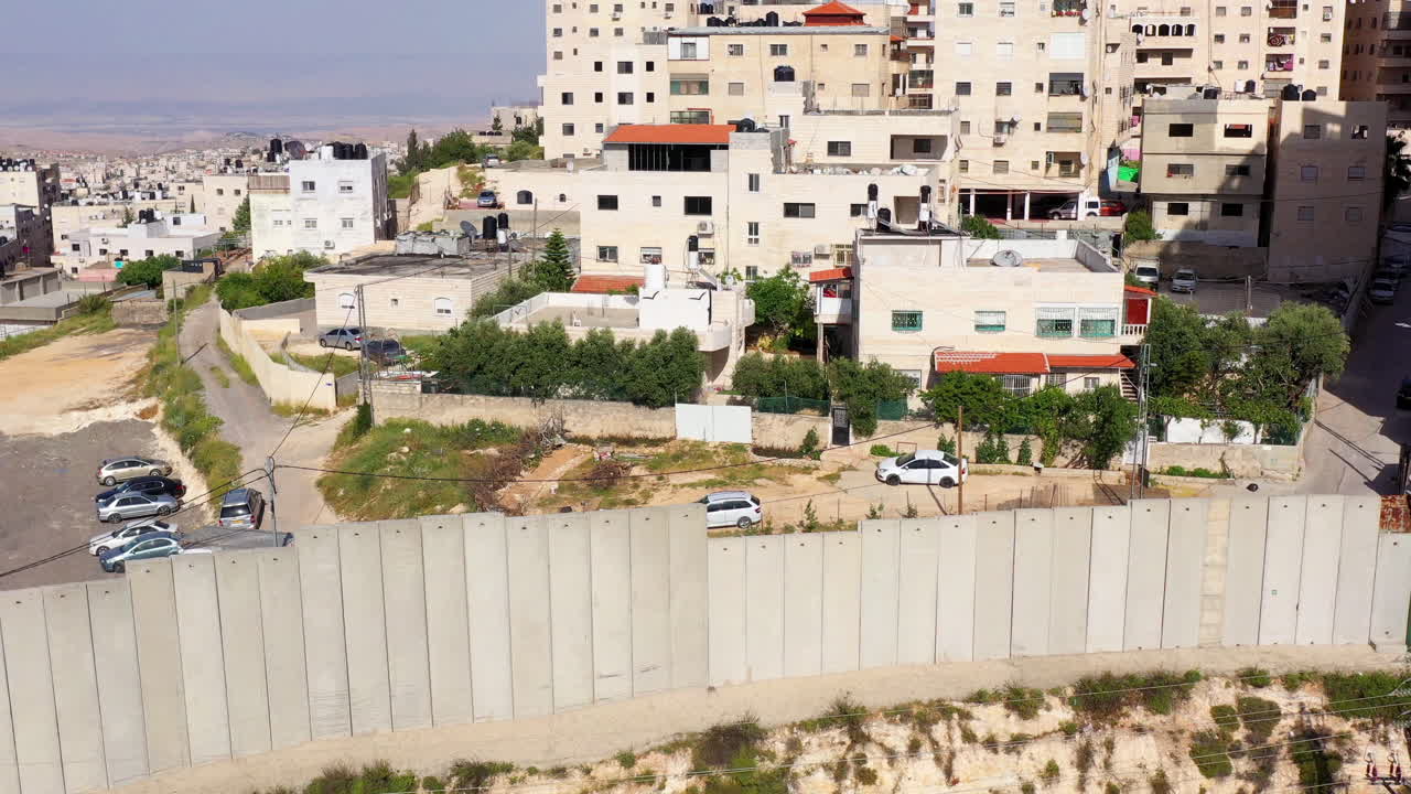 Security wall with Israeli idf watch tower Close to Shuafat Refugee Camp- Aerial