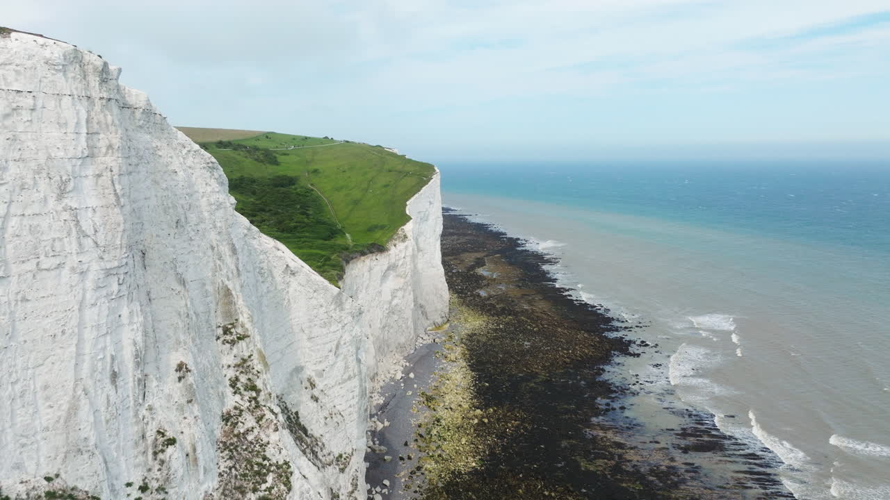 Flying Over The Coastline By The White Cliffs Of Dover In Kent, England, UK. - aerial shot