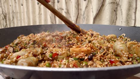 Paella-being-cooked-on-hot-stove