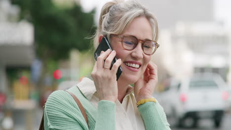 woman talking on phone in the city