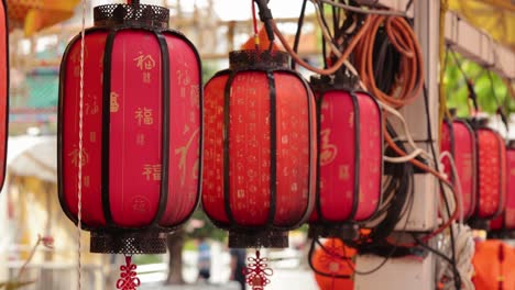 red lanterns hanging in a vibrant market