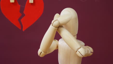 Figurine-in-front-of-broken-heart