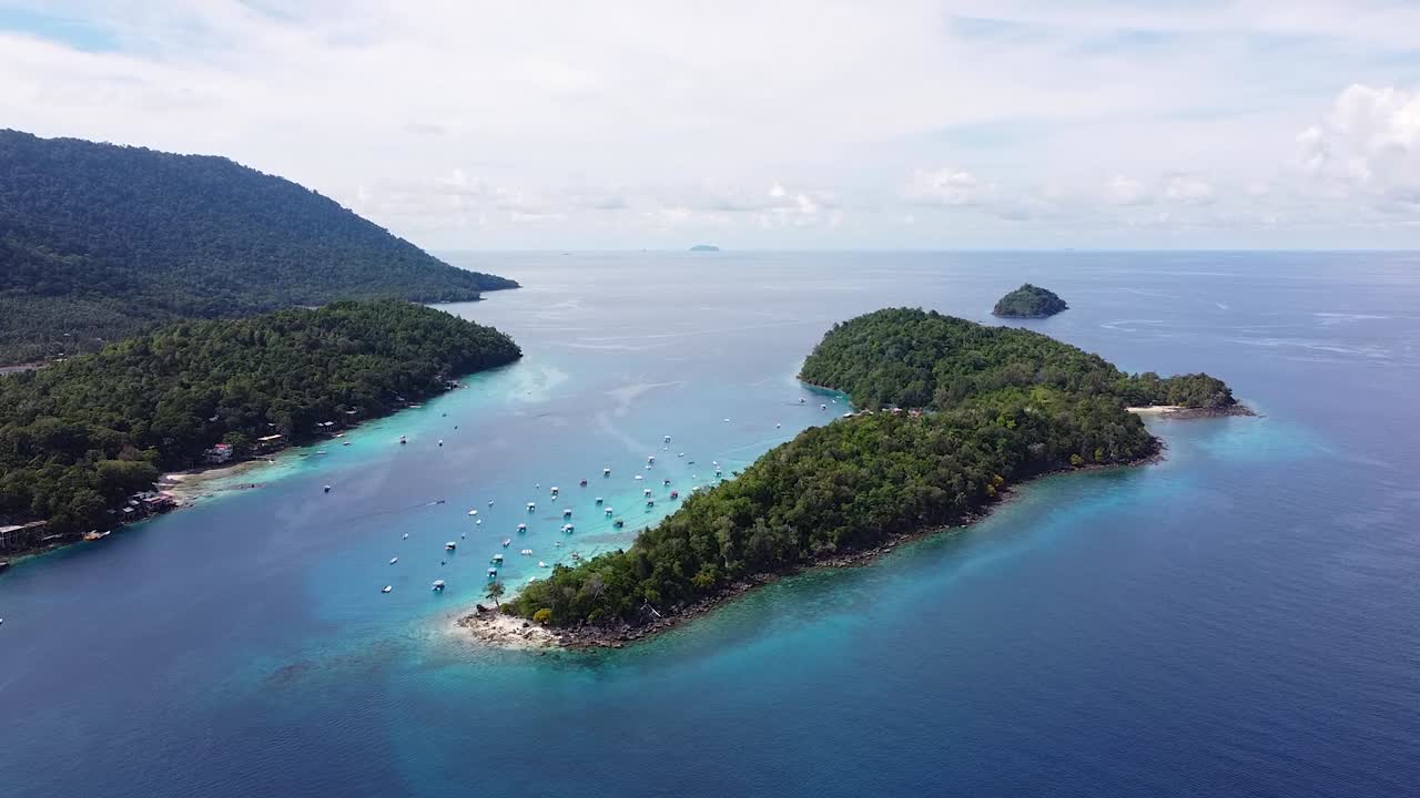 Aerial drone view lowering over tropical island of Pulau Rubiah on Pulau Weh Sabang in Sumatra, Indonesia