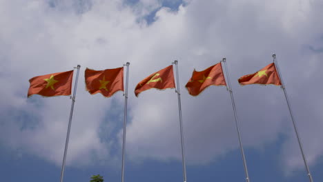 4k video of national flags of vietnam with a flag of communist party of vietnam or cpv