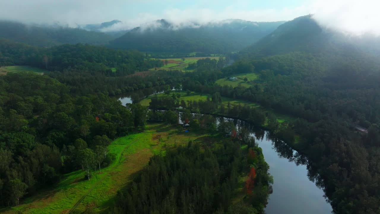 Aerial View of Serene River Valley in the Mountains