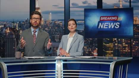 elegant newscasters presenting news evening television closeup. hosts reporting