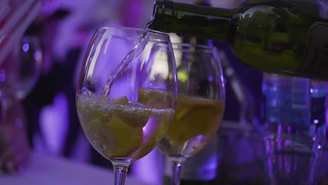 pouring cocktails at an event