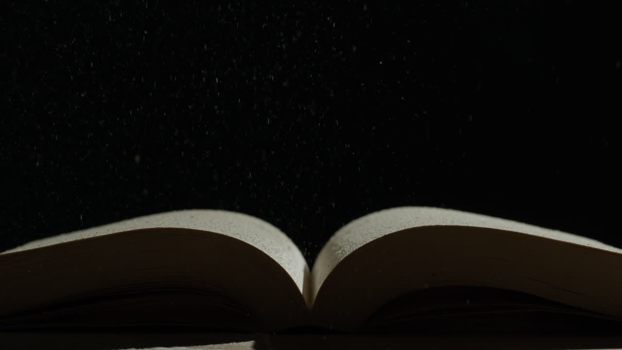 Open Book with Flying Dust