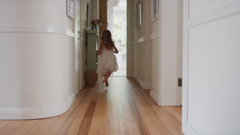 happy little girl running through house wearing excited to play outside child having fun on weekend morning enjoying wearing pretty white dress 4k