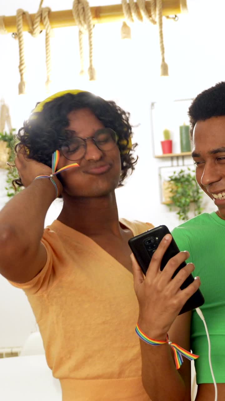 Two people listening to music with headphones