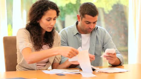 Young-couple-working-on-their-accounts