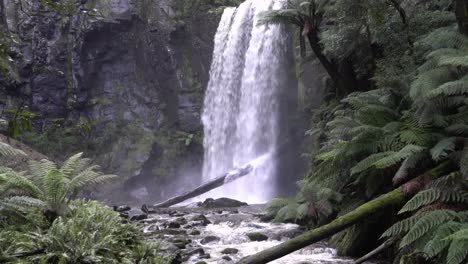 Waterfall-flowing-into-rocky-river-stream-in-Australian-rainforest