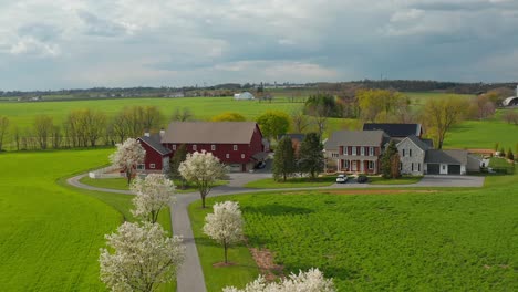 aerial reveals beautiful farm with red barn