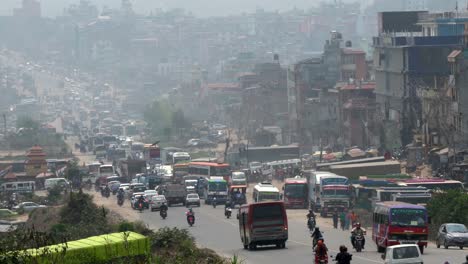 The-busy-city-streets-and-the-heavy-pall-of-smog-hanging-over-the-city-of-Kathmandu,-Nepal
