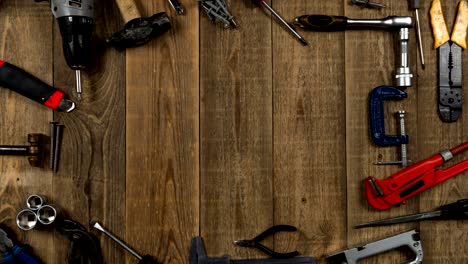 logo intro animation of repair tools on a wooden table top view