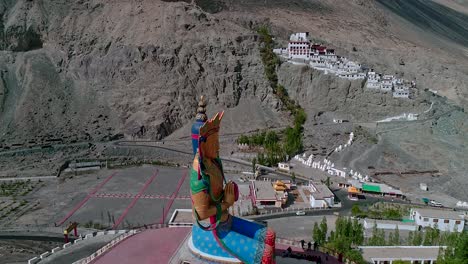 diskit gompa buddhist monastery with nearby gold budha statue