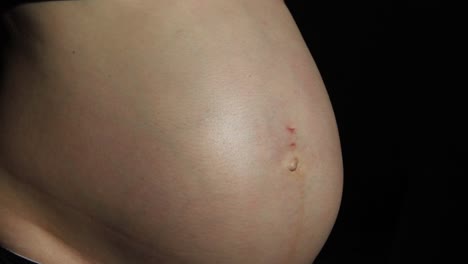 baby moving inside pregnant womans belly