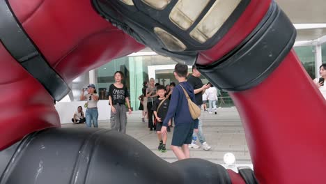 hong kong’s 8-meter deadpool display attracts locals and tourists alike, set up to promote disney’s "deadpool and wolverine" movie.