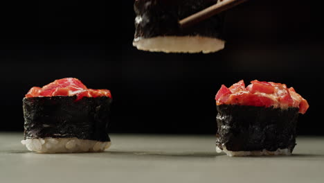 close-up of sushi being prepared or served