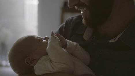 father holding baby