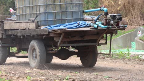 a trailer being loaded with large water tanks